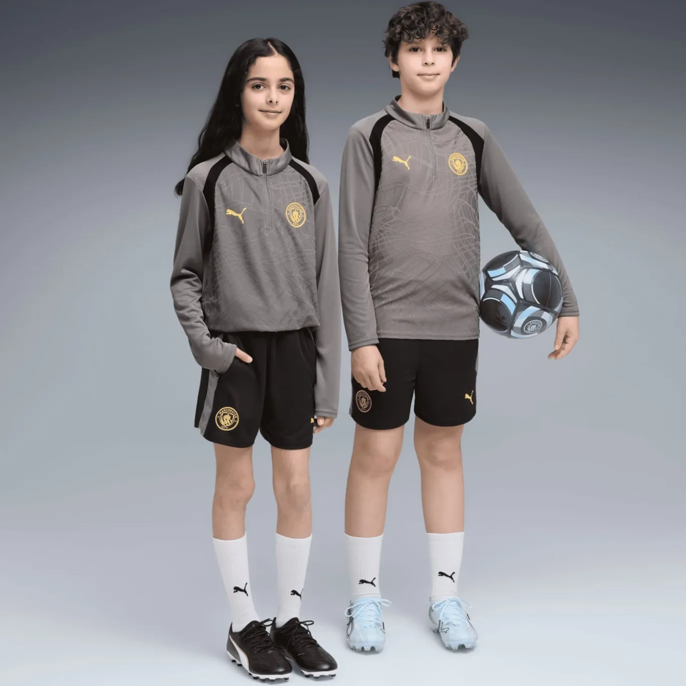 PUMA Manchester City Trainingsbroekje 2026-2027 Kids Zwart Donkergrijs Goud