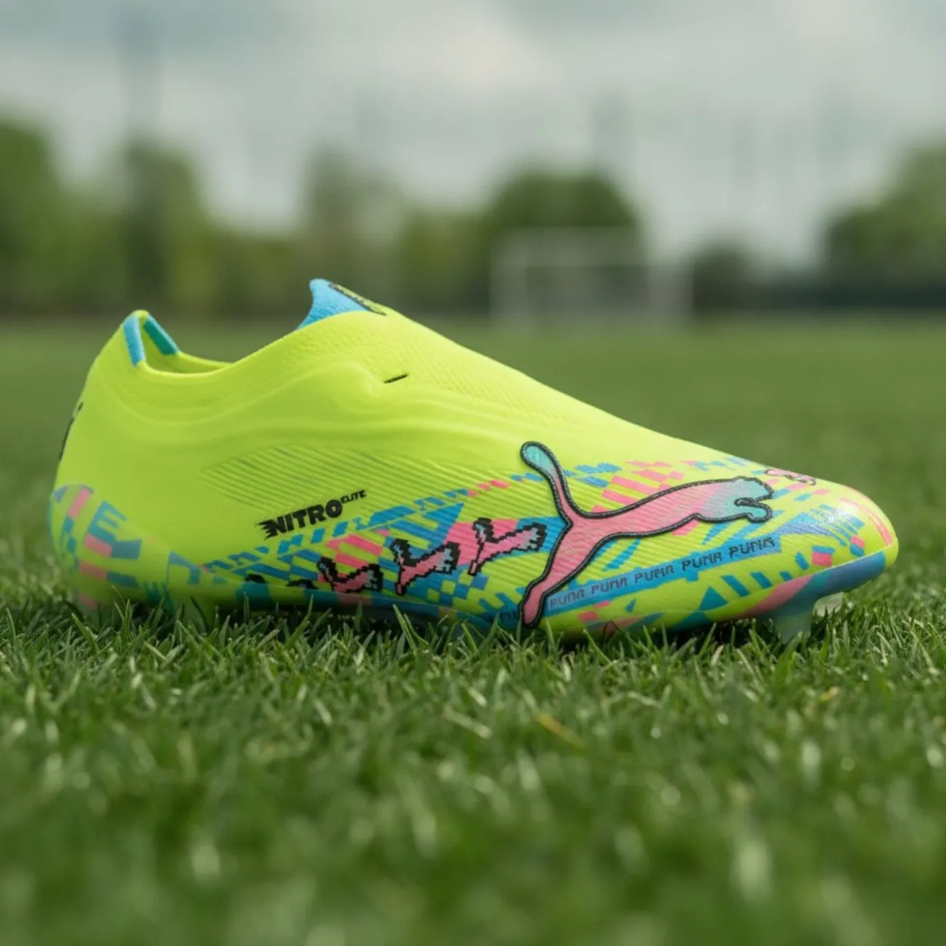 PUMA Ultra Nitro 7 Ultimate ADV Veterloze Gras Voetbalschoenen (FG) Neongroen Felblauw Felroze